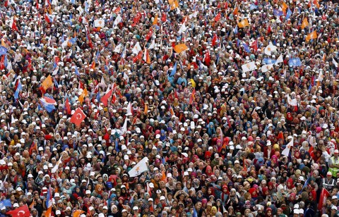 Supporters of the ruling AK Party listen to Turkish PM Davutoglu during an election rally for Turkey's June 7 parliamentary election, in Konya